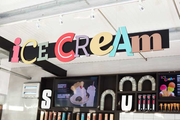 Ice Cream signage hanging above shop counter